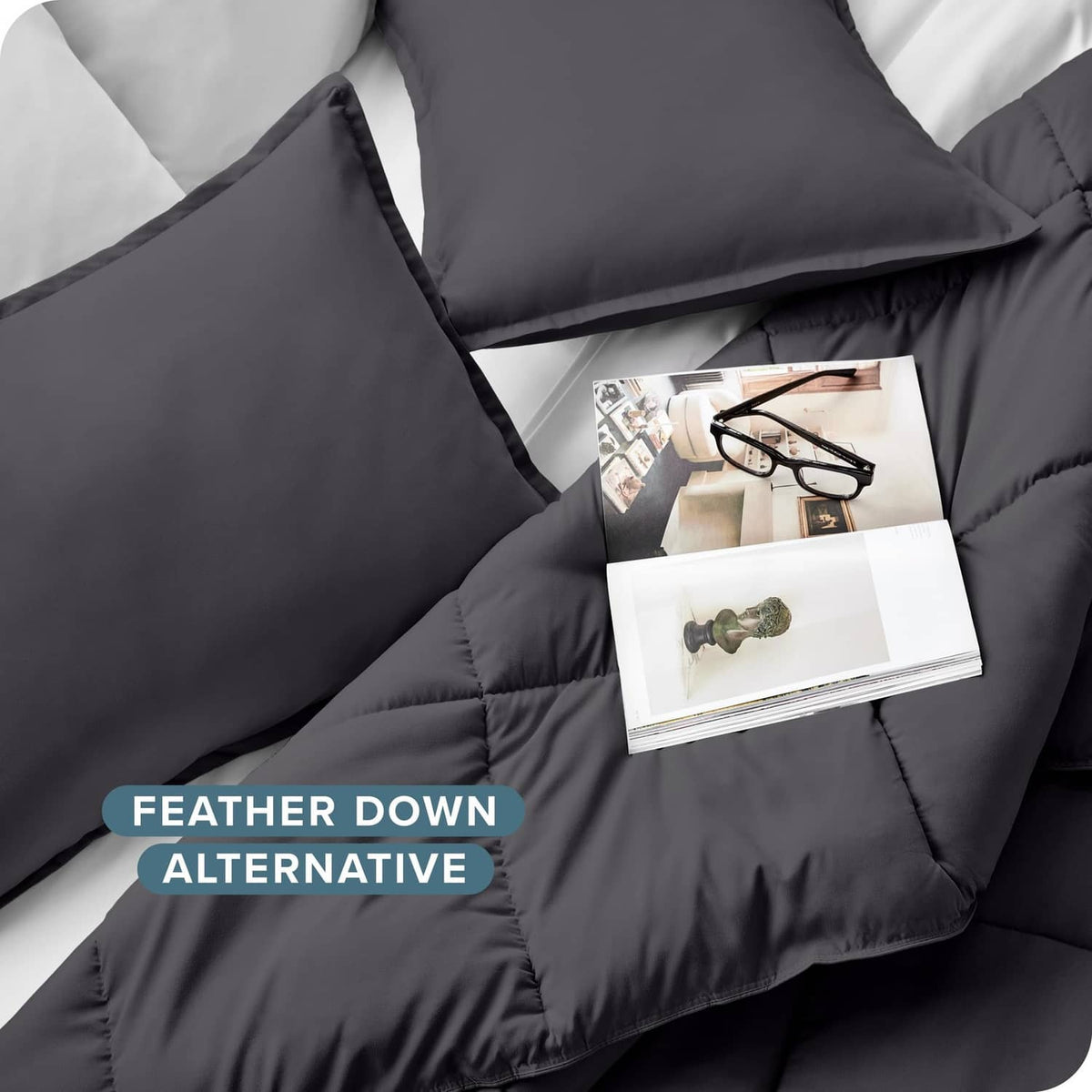 Grey down-alternative comforter and pillow shams with visible stitched channel quilting