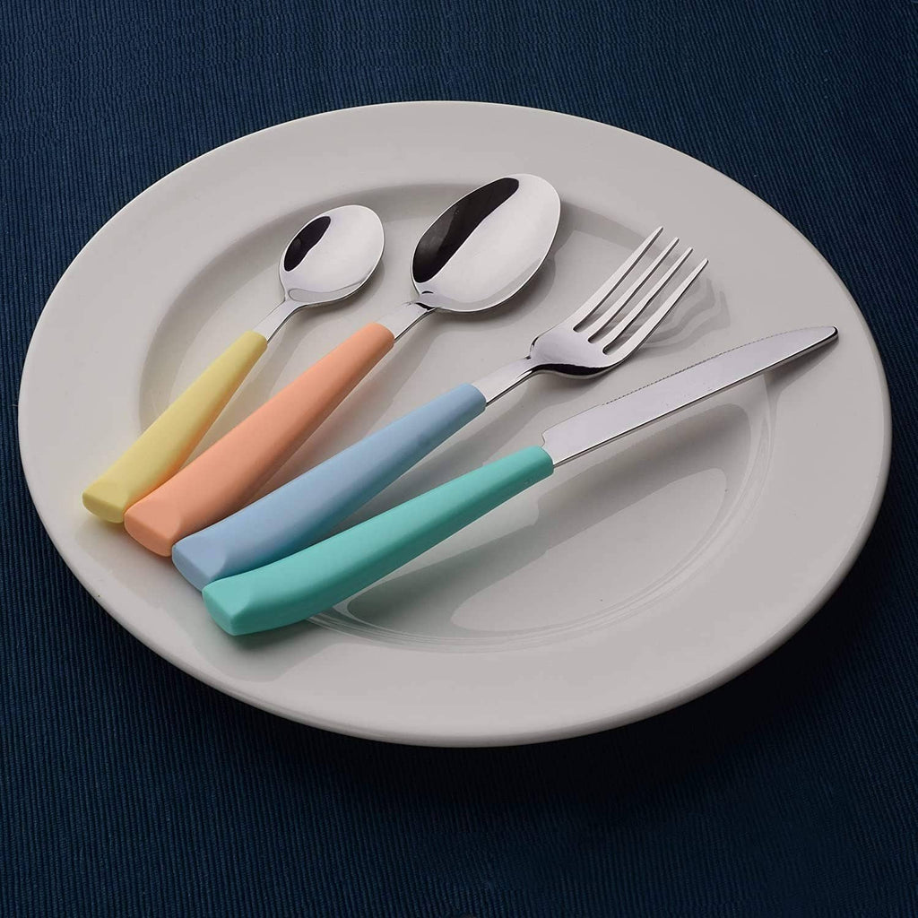 Stainless steel spoon, fork, and knife with pastel colored handles on a plate