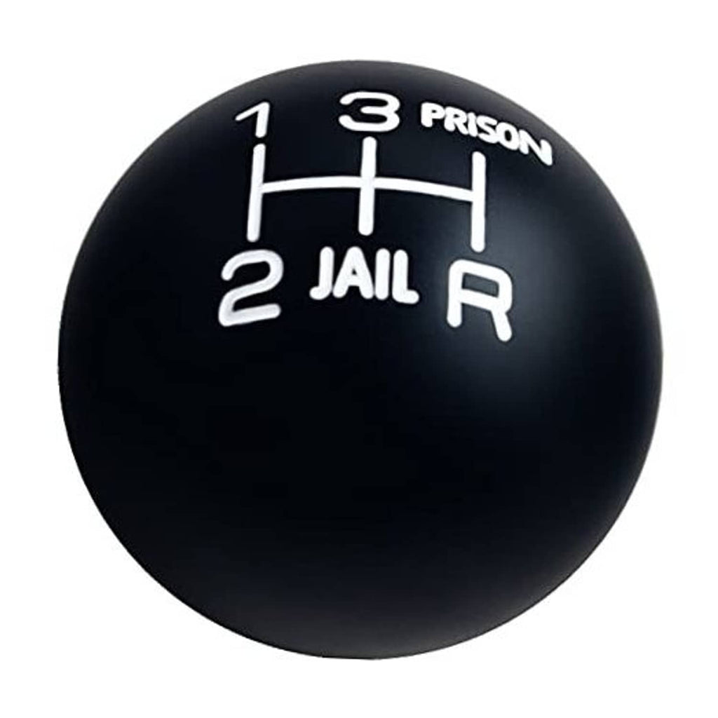 Round black gear shift knob with white numbers and prison-themed markings