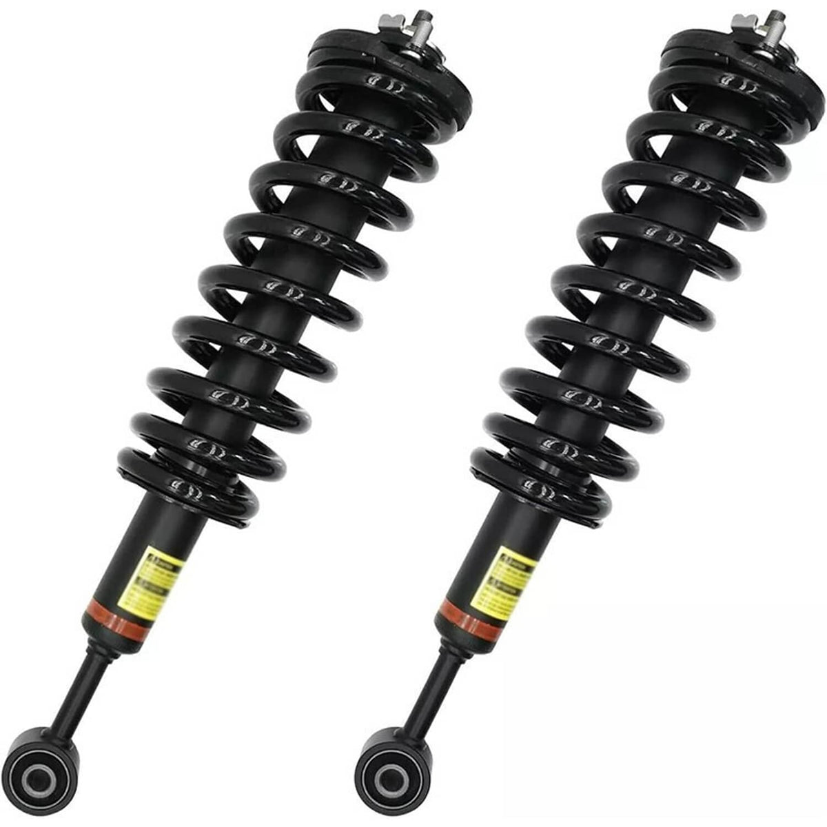 Pair of black coil spring shock absorbers with yellow label band and lower rod mount