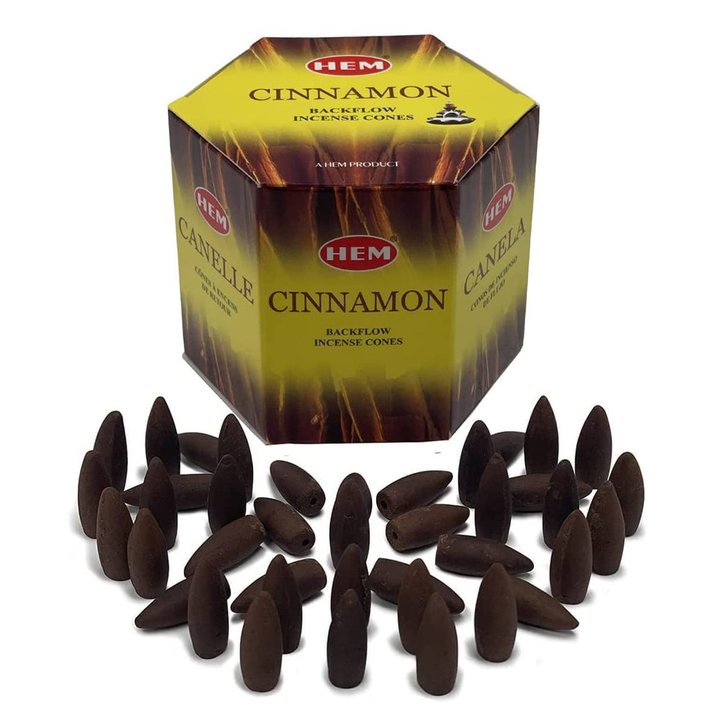 Backflow incense cones cube box with dark brown cones scattered