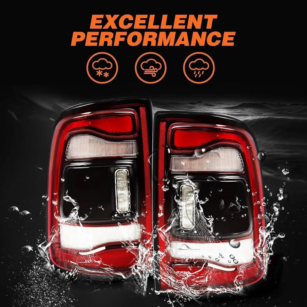 LED tail light pair splashed with water, red and clear lenses over black bezels.
