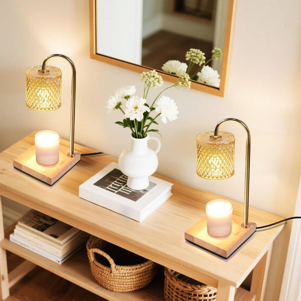 Candle warmer lamp with gold arched stand and amber textured glass shade on wooden base