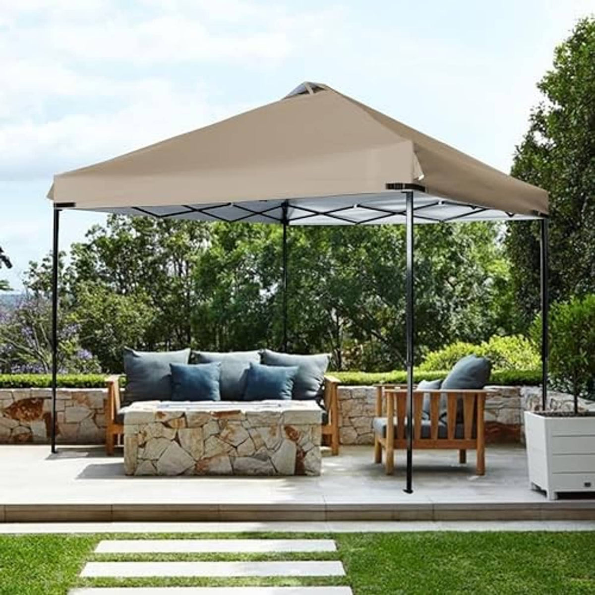 Khaki gazebo canopy top on black metal legs outdoors