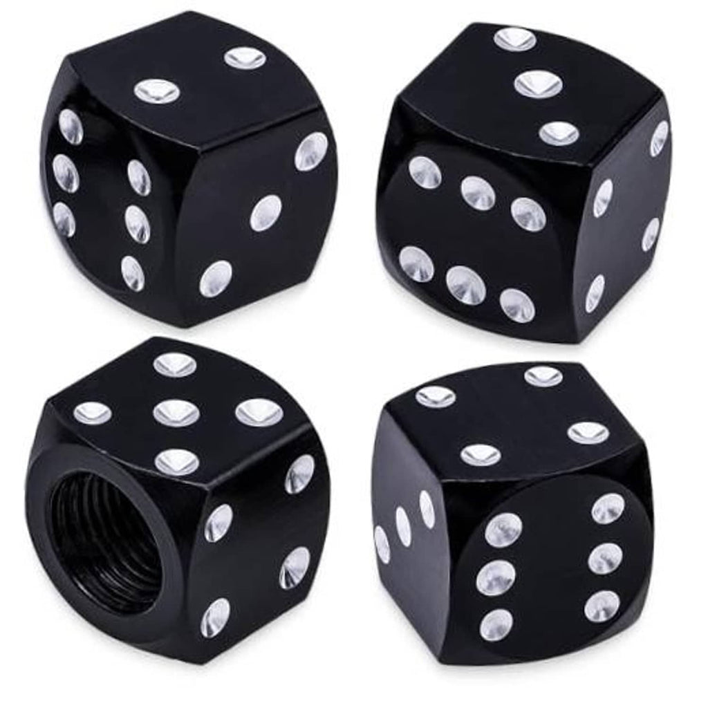 Four black dice-style tire valve stem caps with silver dots, angled view set