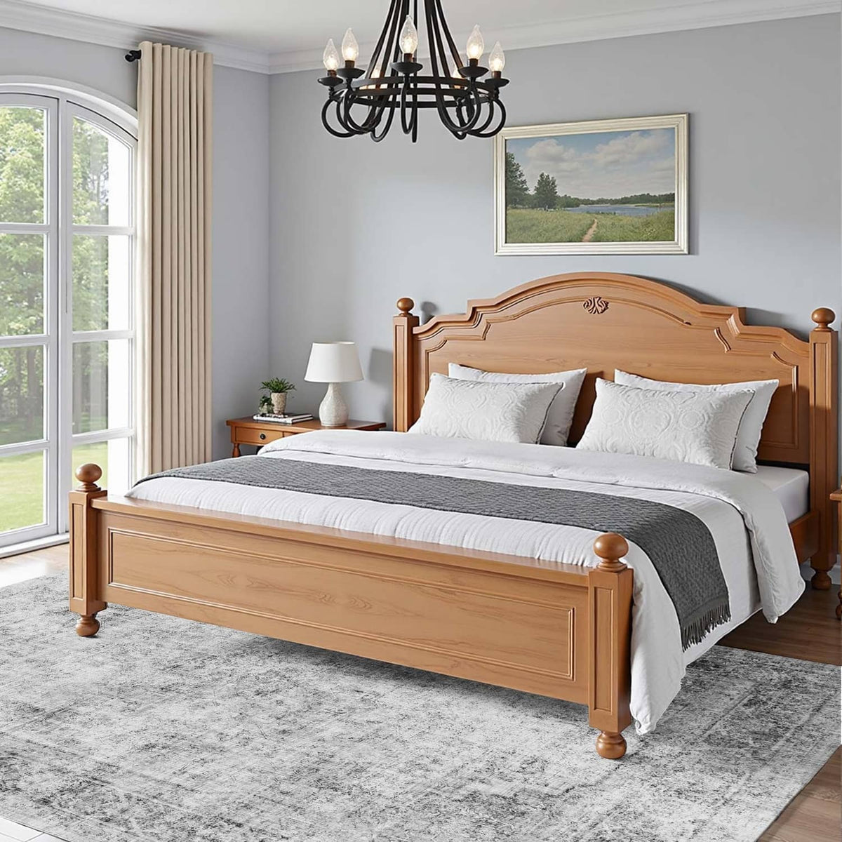 Gray distressed area rug beside a bed, featuring an abstract, mottled pattern
