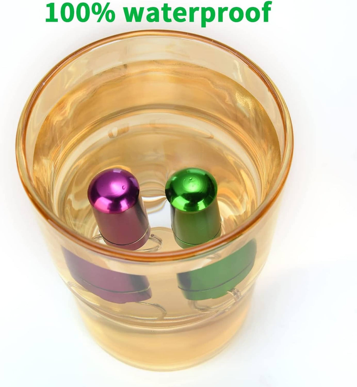 Water-filled clear cup showing waterproof pill cases with purple and green contents inside.