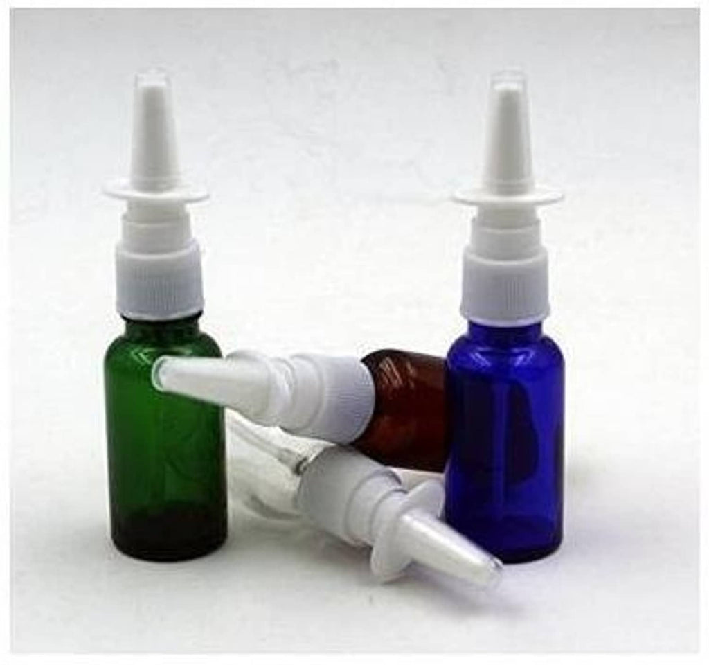 Green and amber glass nasal bottles with white pump nozzle tips and applicators