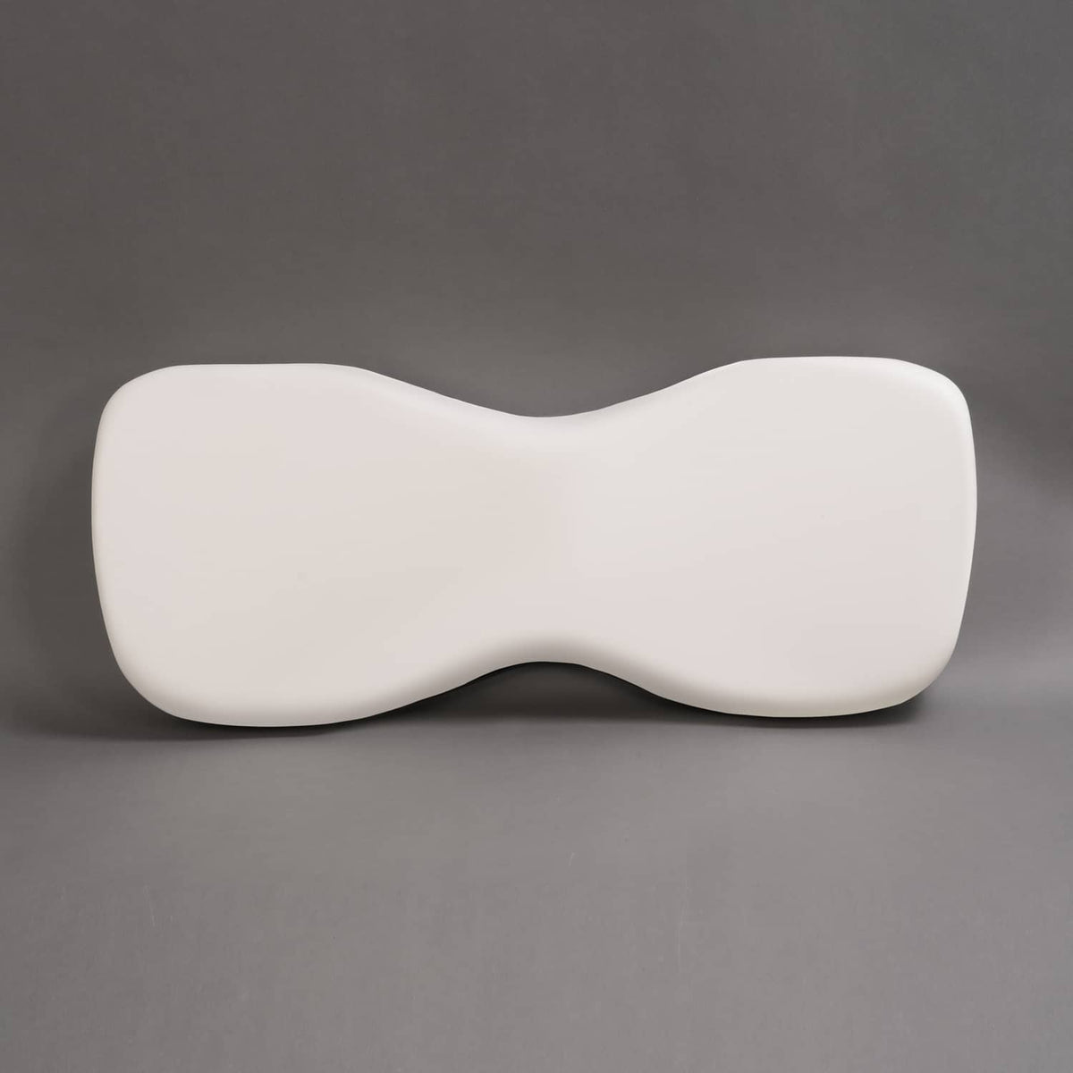Front seat backrest pad assembly in white, curved ergonomic shape with smooth surface