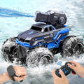 Blue and black amphibious RC tank car with large tread tires, splashing in water