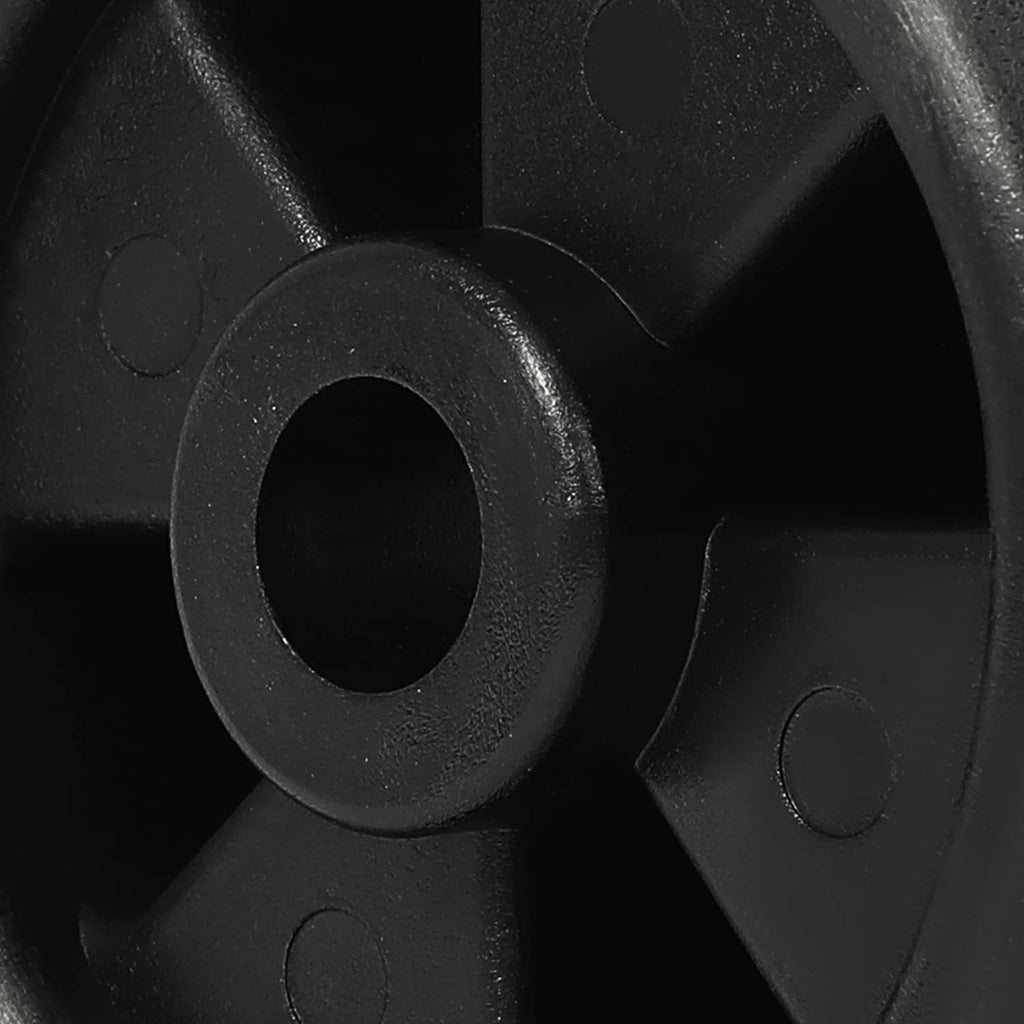 Close-up of black wheel hub spokes with circular axle hole and molded details