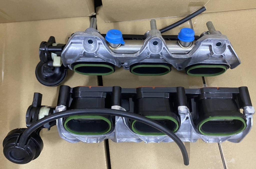 Intake manifold pair with three green-lined openings; silver metal housings and black hoses
