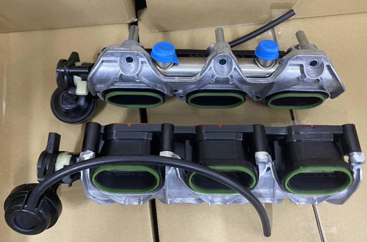 Intake manifold pair with three green-lined openings; silver metal housings and black hoses