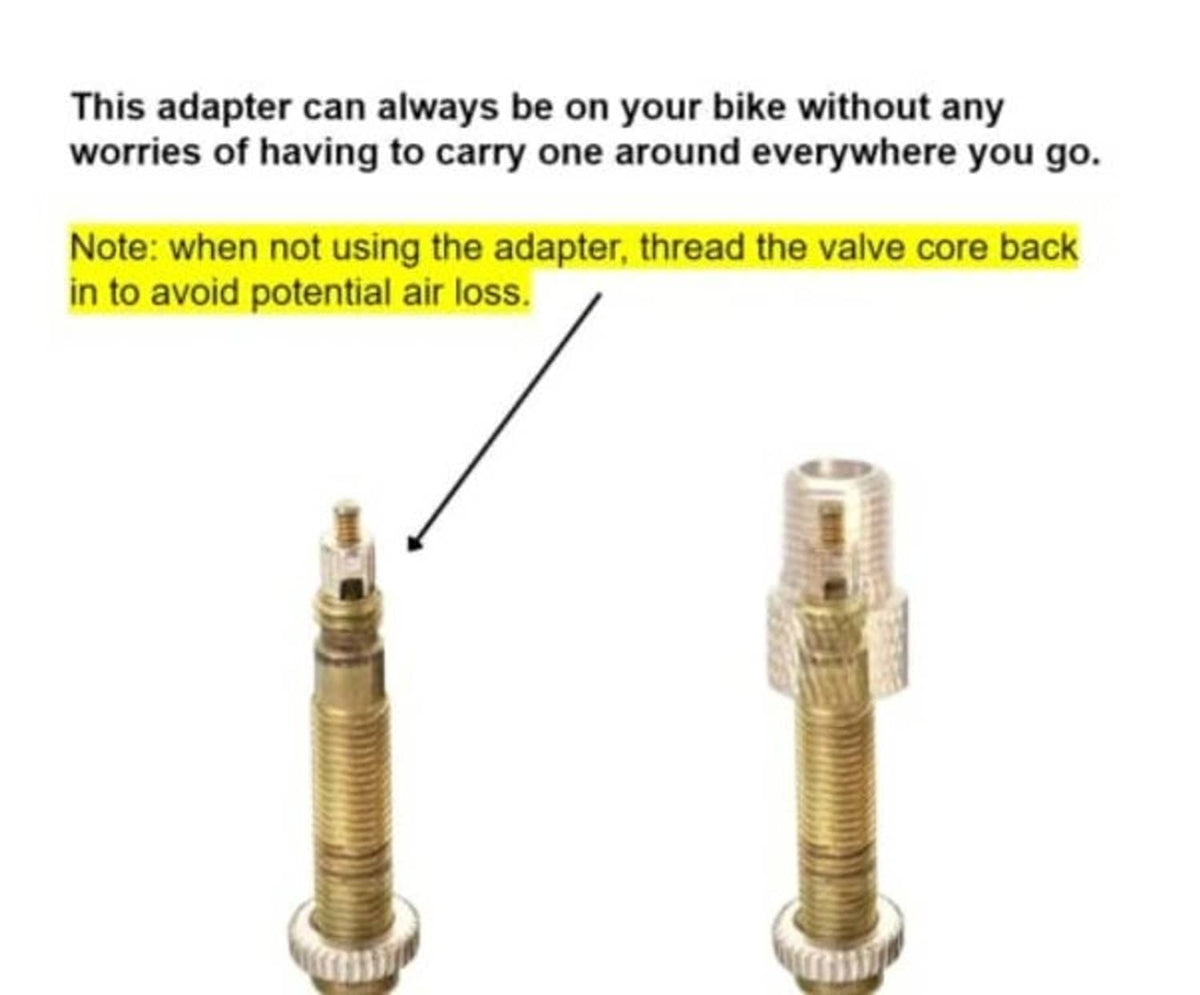 Brass Presta-to-Schrader adapter installed on a bike valve, with storage note