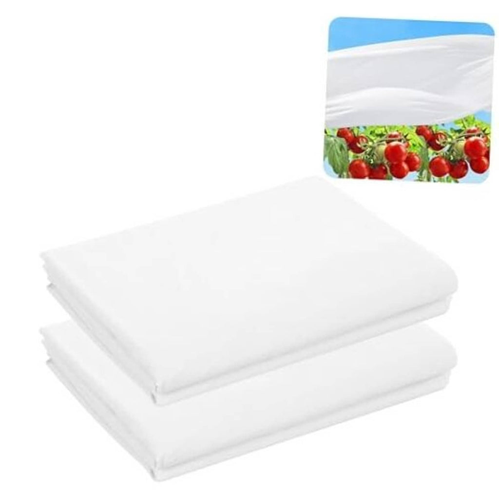 White plant sun protection cloth sheets, neatly stacked with folded edges