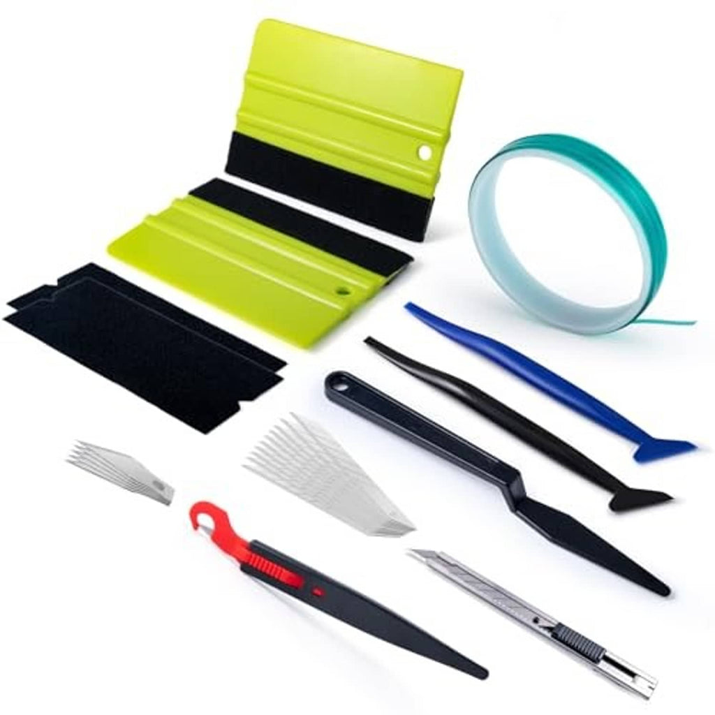 Window tint installation kit with tinted film pieces, teal roll, squeegees, and cutting tools