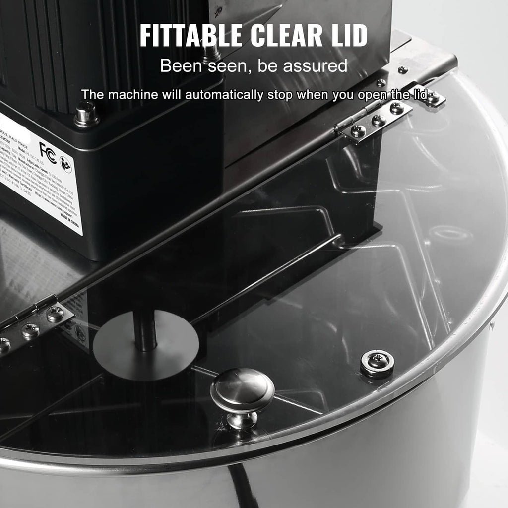 Electric honey extractor with motor housing and fitted clear protective cover