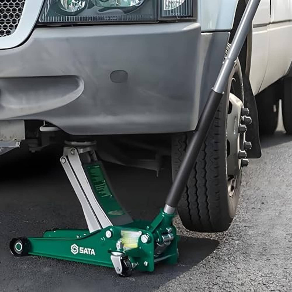 Hydraulic floor jack with return spring kit components under the lift base