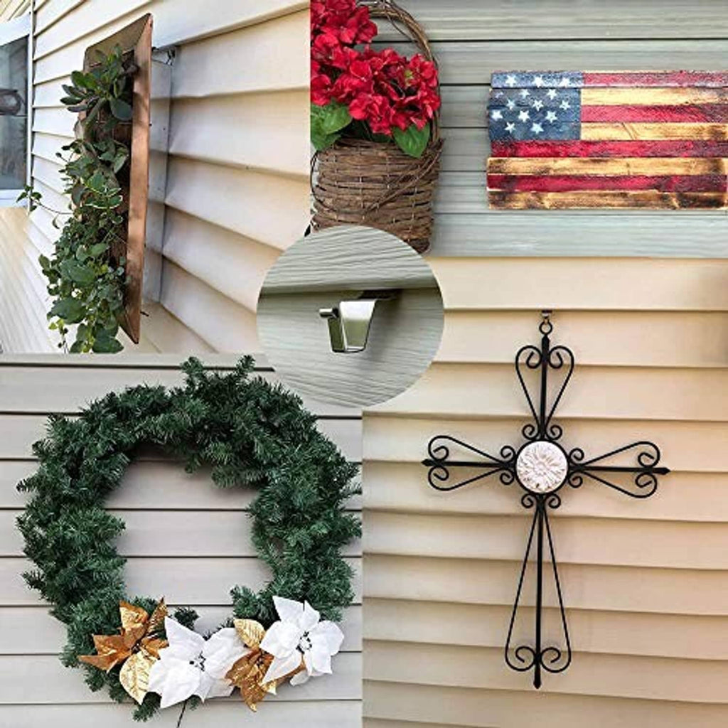 Vinyl siding hook holding a wreath and planter, silver-gray metal wall clips