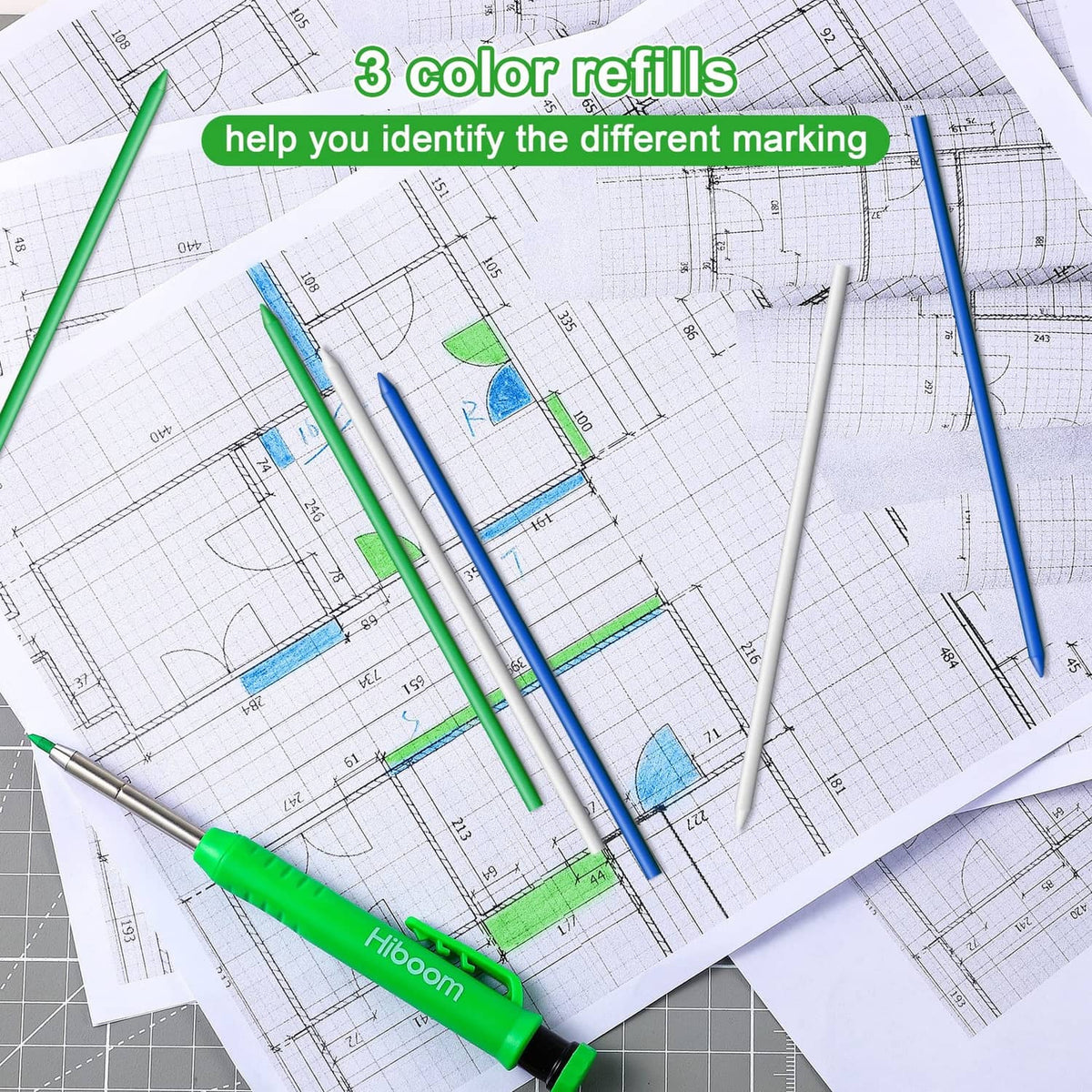 Blue, green, and white pencil refills on architectural blueprint paper