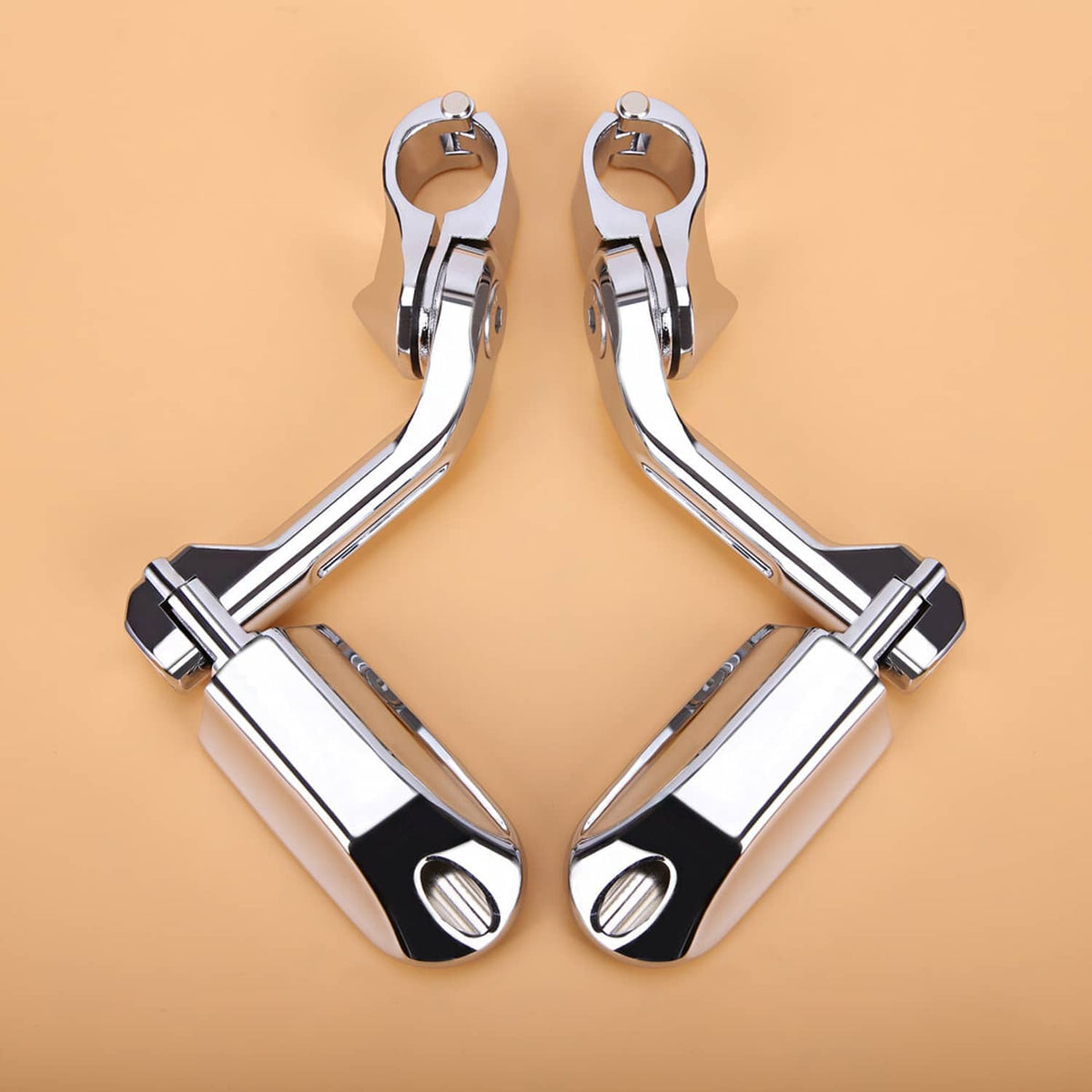 Motorcycle highway foot peg bracket with chrome frame and black tread pads