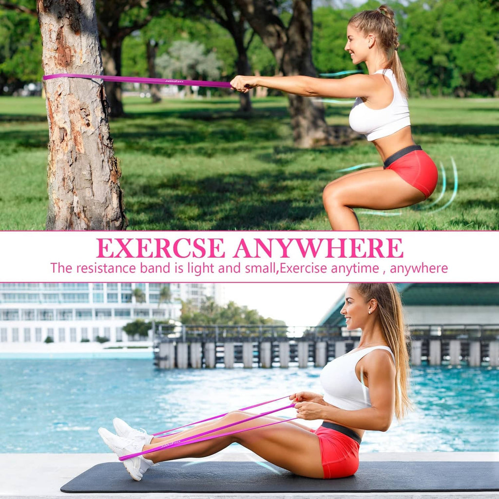 Pink resistance band used for squats on grass and core work on a mat