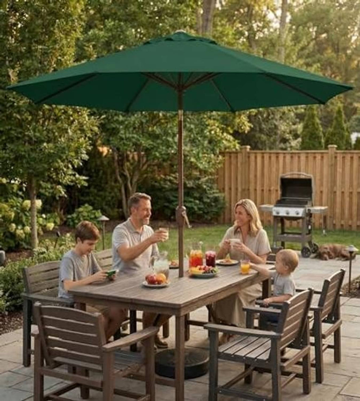 Dark green patio umbrella above backyard dining table and chairs