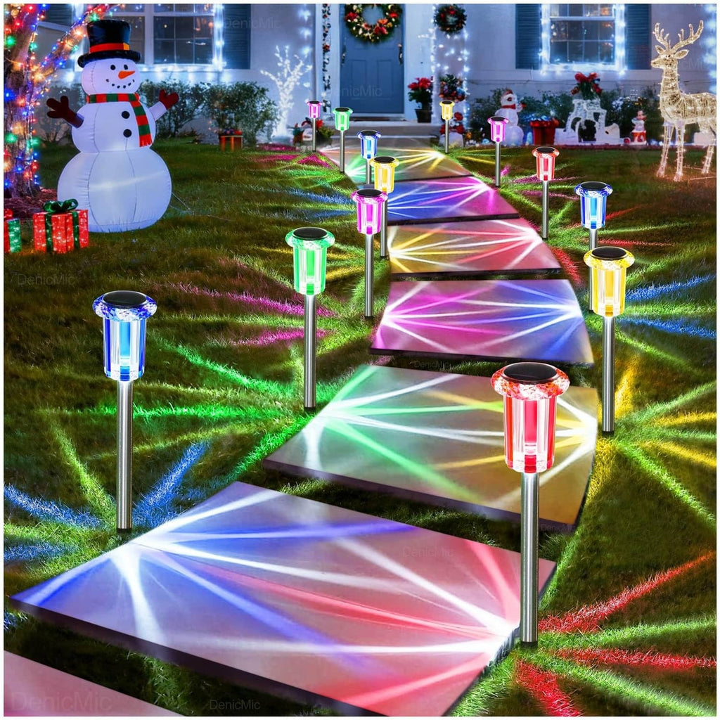 Outdoor solar LED stake lights in a yard walkway with multi-color lighting accents