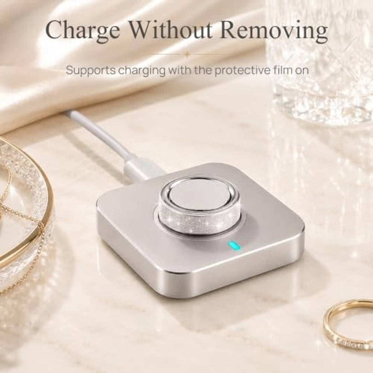 Ultra-thin bling silver ring skin cover for Oura Ring Gen 5, size 10, on charging dock
