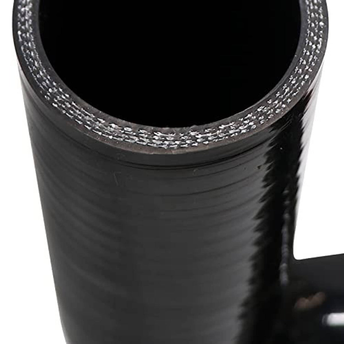 Black silicone reducer elbow close-up of reinforced seam and textured rubber layer