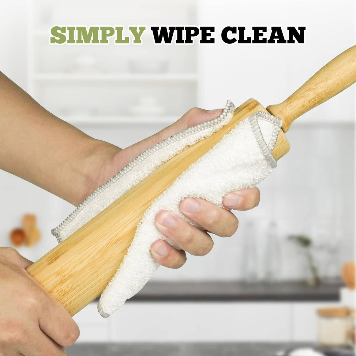 Bamboo rolling pin being wiped with a cleaning cloth