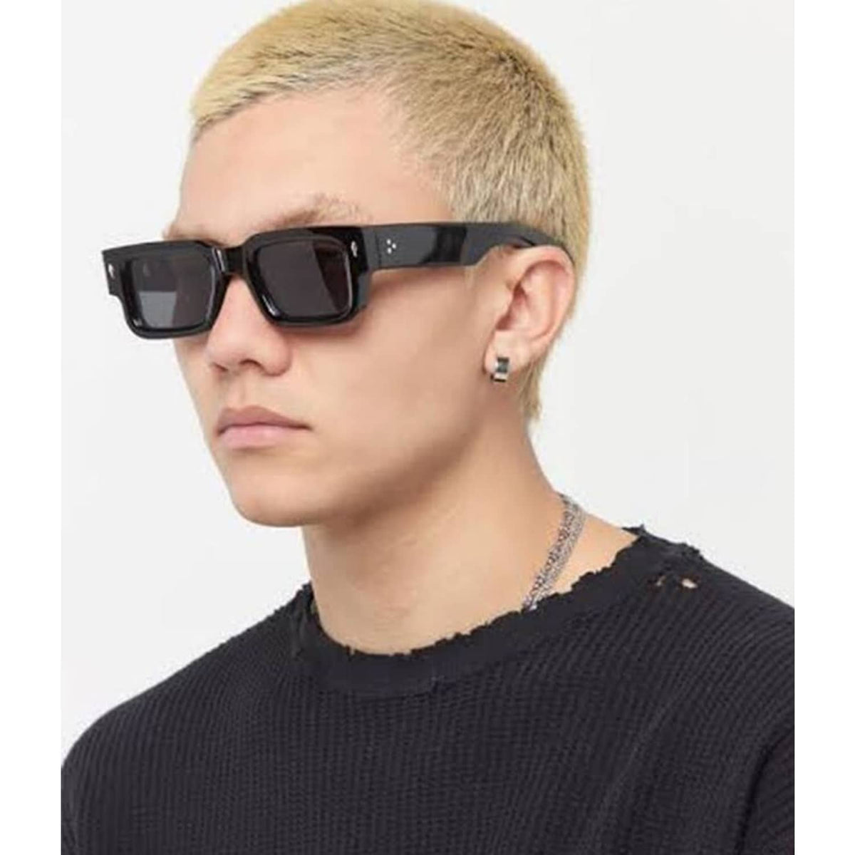 Black thick square sunglasses on profile with dark lenses and chunky frame