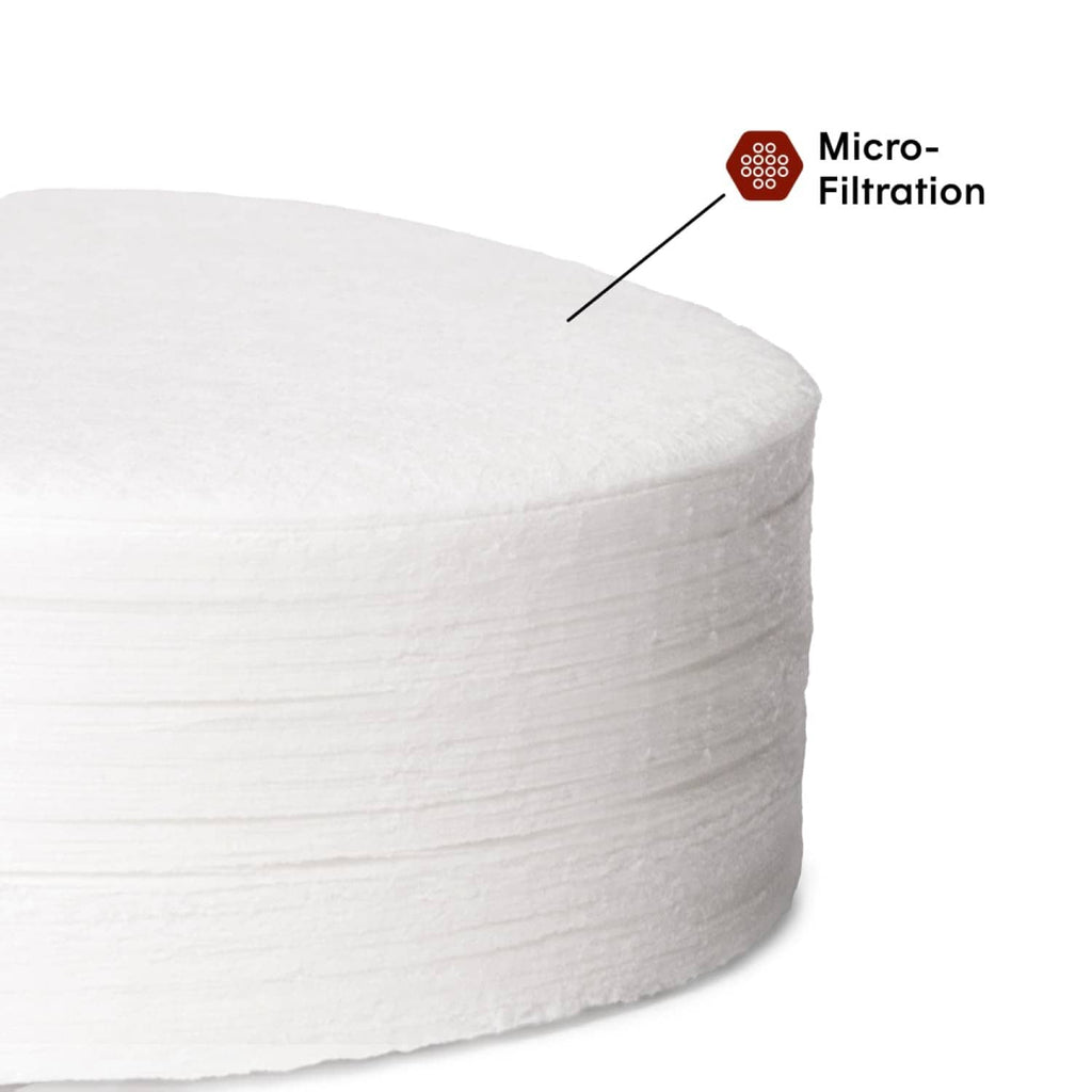 Stack of white AeroPress Micro-Filters paper discs