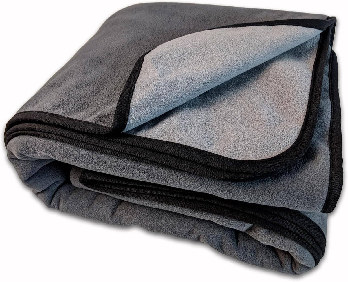 Folded gray waterproof bed cover blanket with soft textured surface