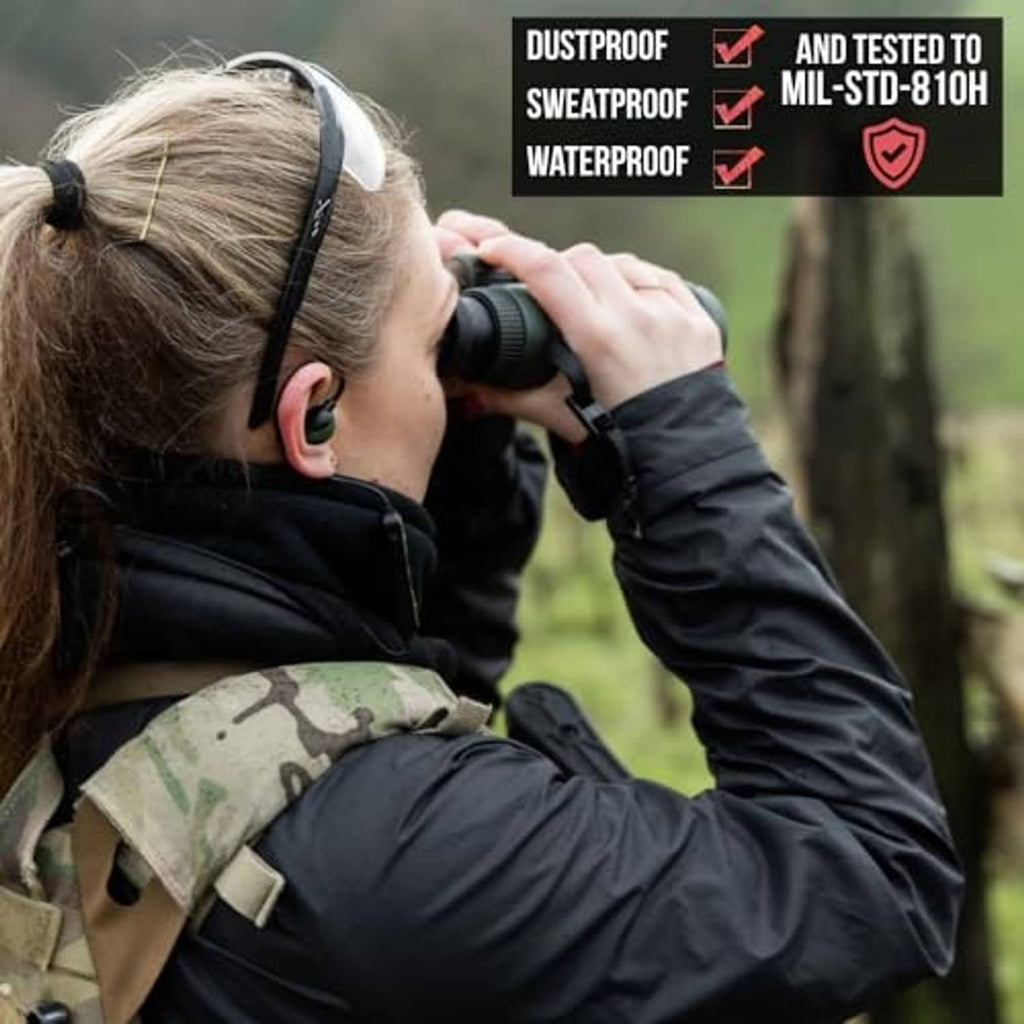 Bluetooth shooting ear protection with dark earmuffs while using handheld earbuds
