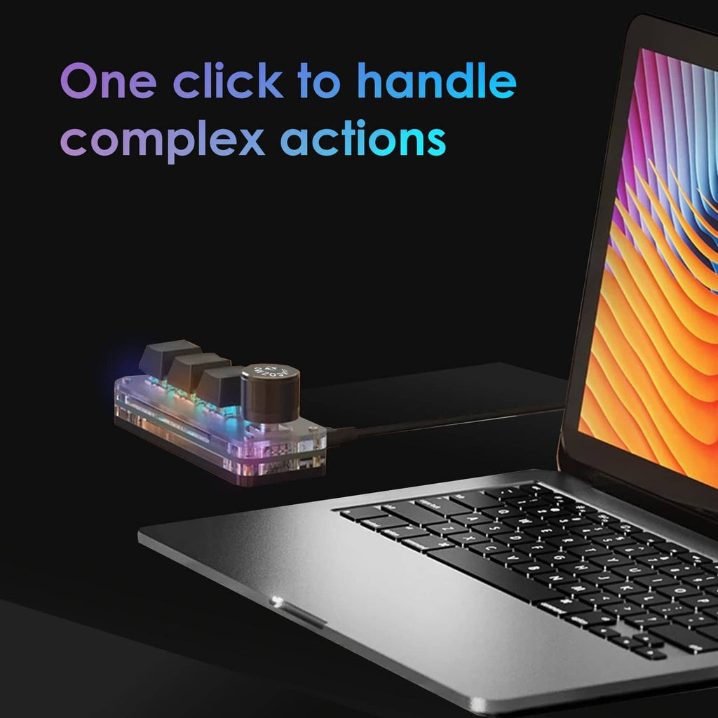 Black macro keypad with 3 keys and round dial, illuminated LEDs by a laptop