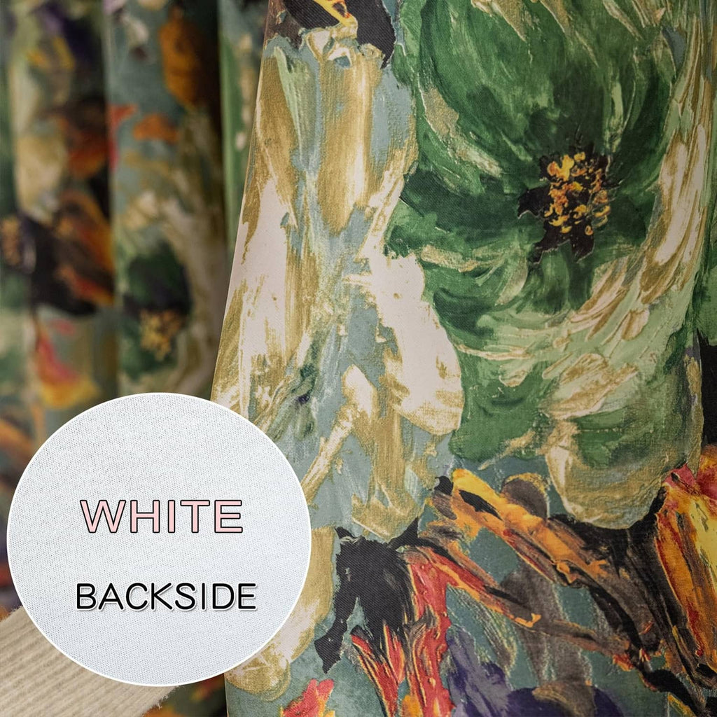 Green floral curtain fabric close-up with white backside marker