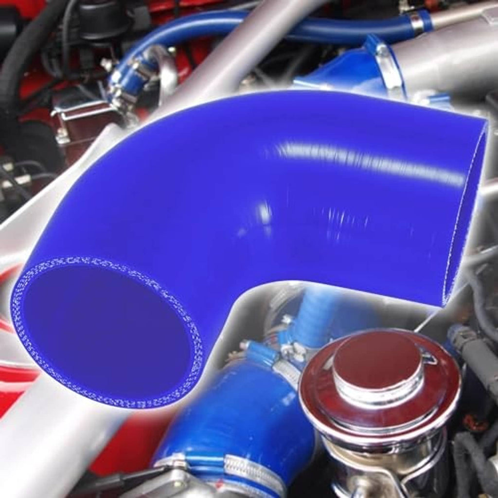 Blue 90-degree silicone hose elbow installed with nearby metal clamps and fittings