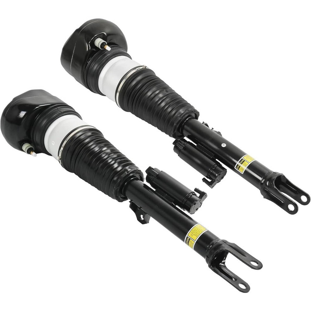 Two air suspension struts with black bodies, silver sleeves, and yellow warning decals