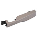 Beige front passenger door armrest handle with mounting bracket and clips