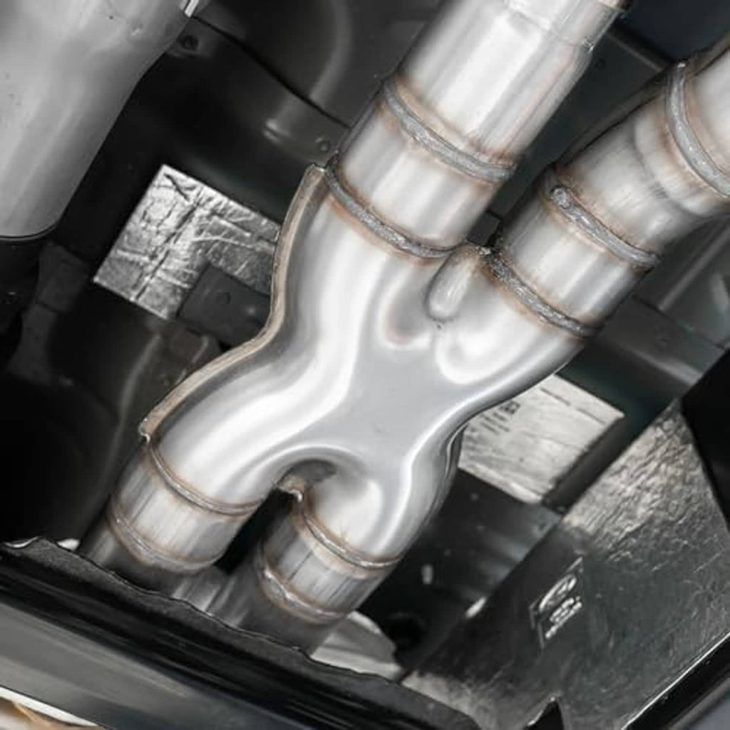 Stainless steel X-pipe crossover exhaust installed between pipes with slip joints