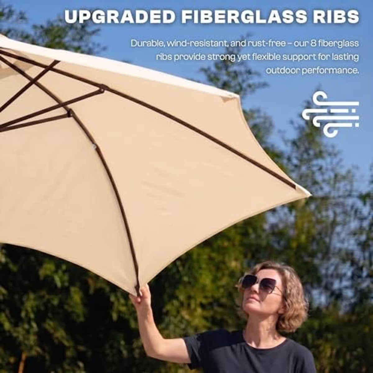 Close-up of khaki patio umbrella canopy fabric with dark ribs