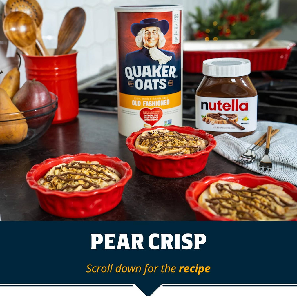 Quaker oats box on holiday table with red baking dishes of pear crisp