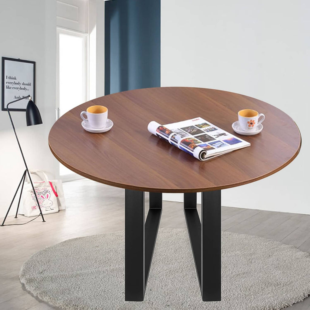 Black metal table legs supporting a round tabletop with two vertical open frames