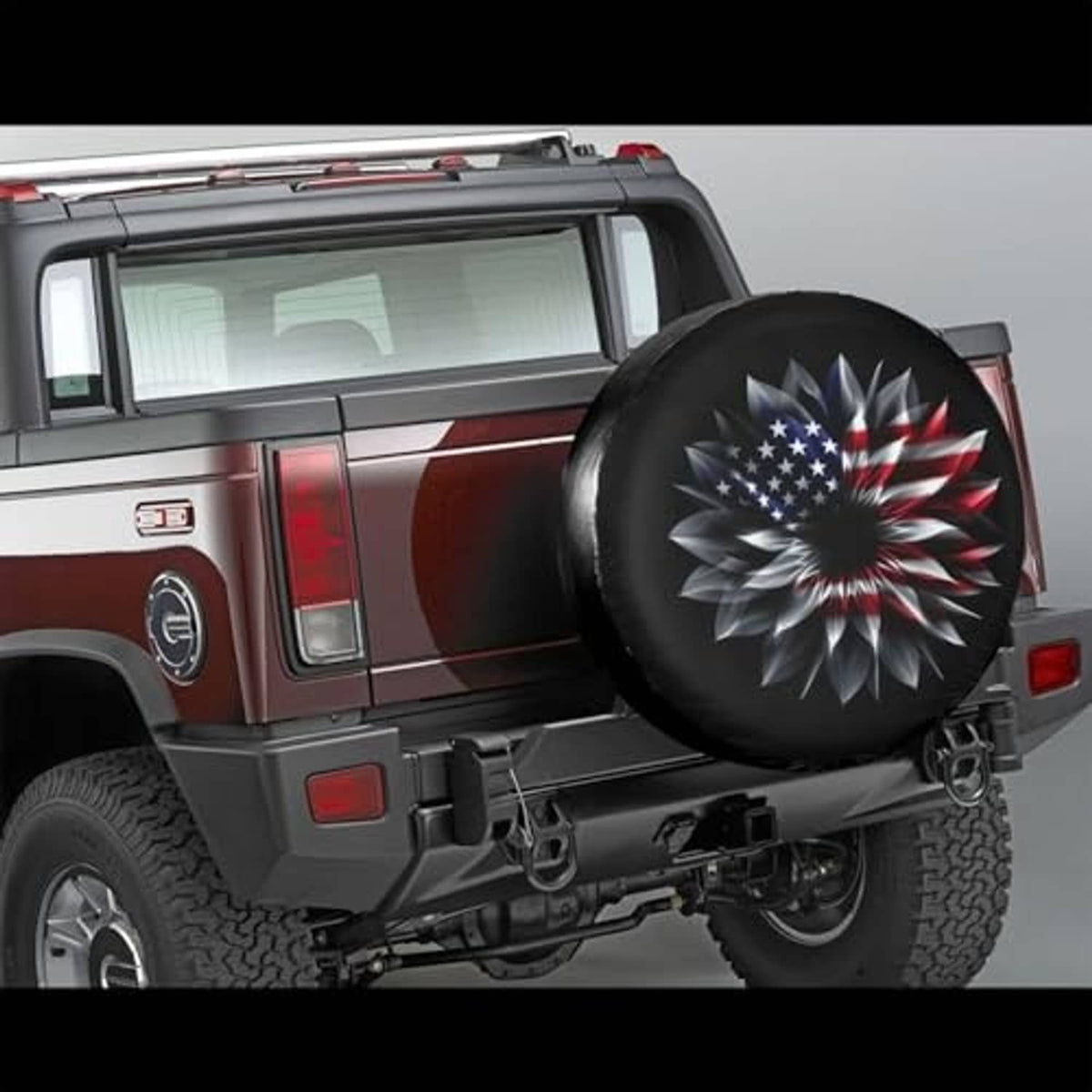 Universal spare tire cover on rear of truck, black with American flag flower graphic