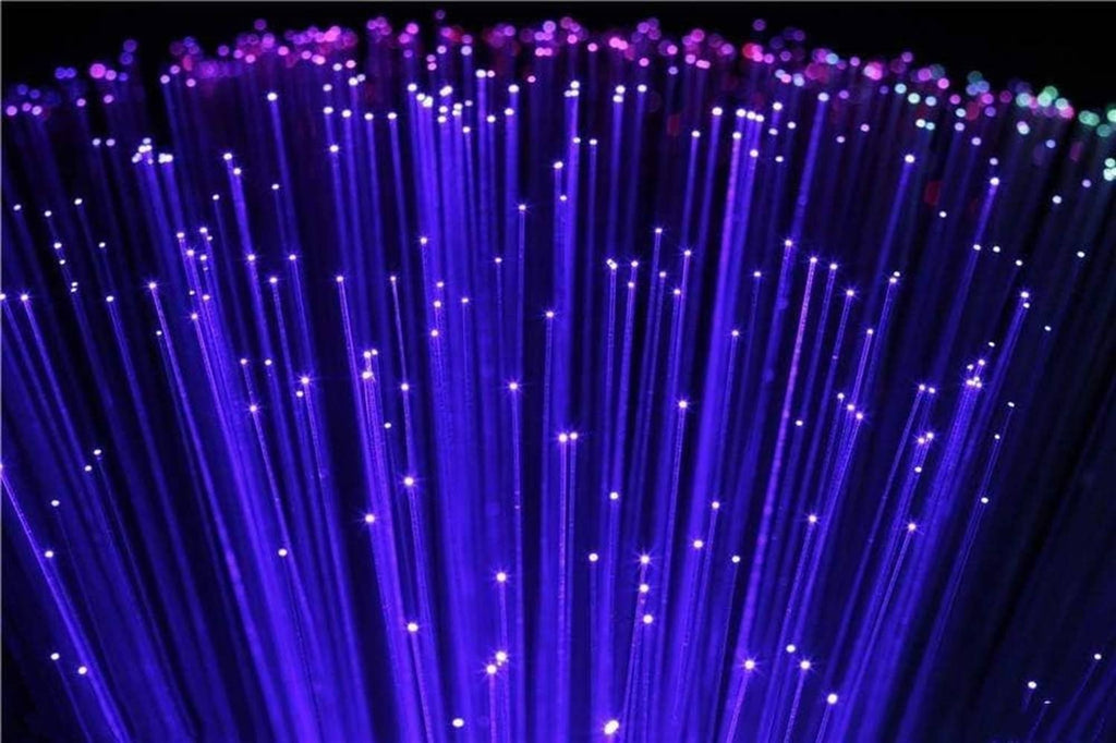 Purple-blue fiber optic light strands with glowing end tips, close-up