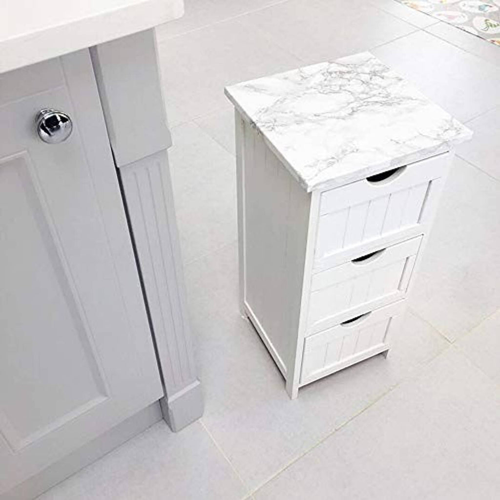 Glossy white marble contact paper covering a vanity top and drawer fronts