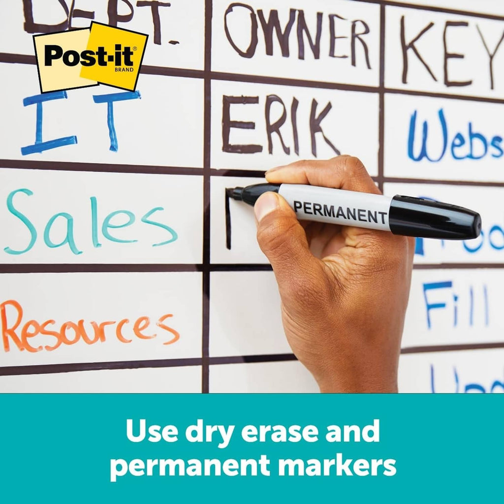 Hand writing with a permanent marker on a grid learning writing surface