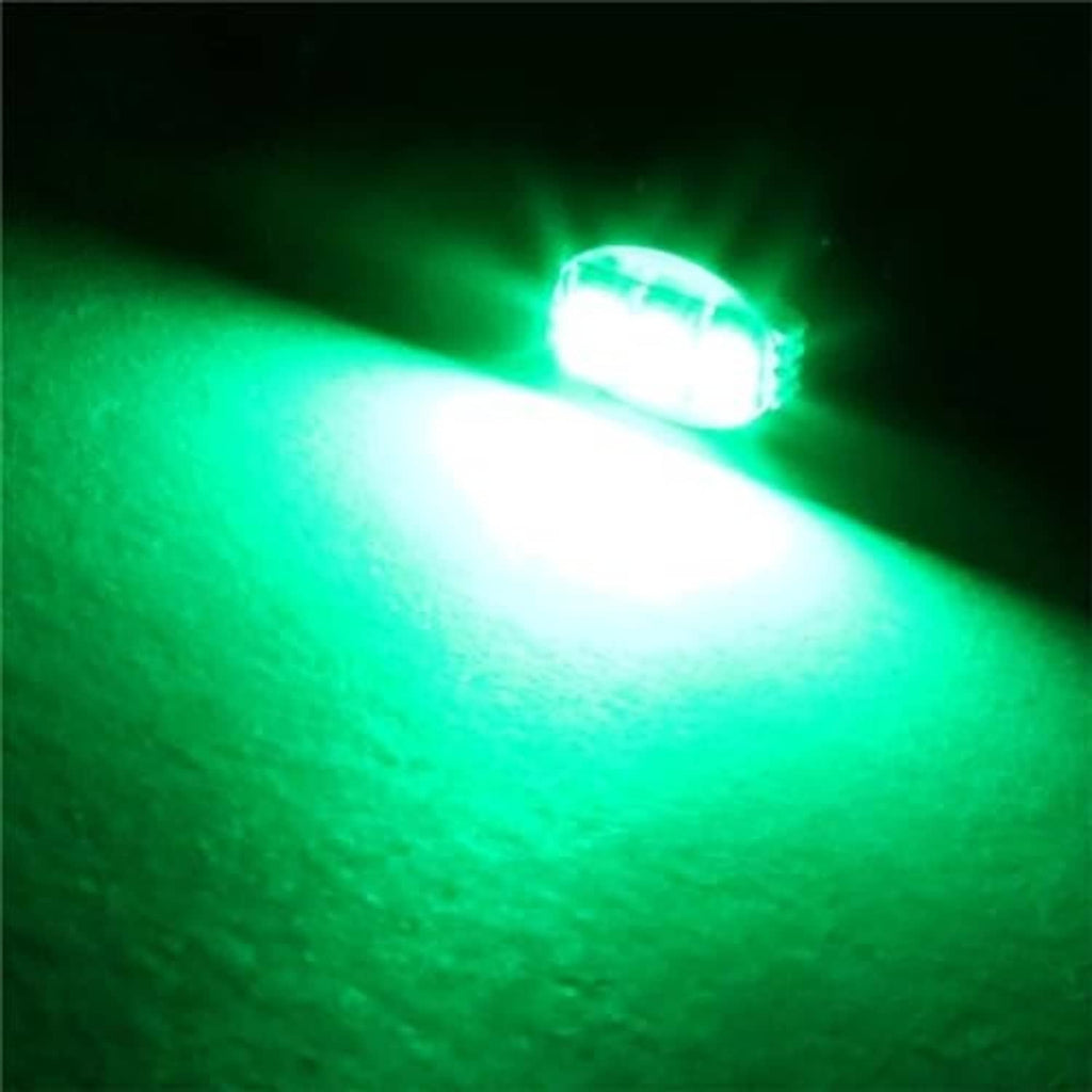 Green LED bulb shining with bright green beam and hotspot