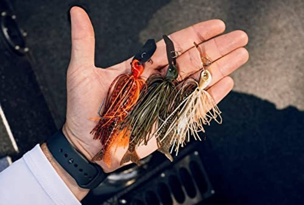 Fishing jig with orange and green skirt, spinner blades and hook